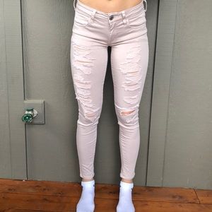 American Eagle distressed light pink jeans